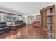 Living room with hardwood floors, leather furniture, and built-ins at 600 30Th N St, St Petersburg, FL 33713