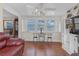 Bright living room with hardwood floors, leather couch, and built-in shelving at 600 30Th N St, St Petersburg, FL 33713