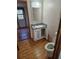 Small bathroom with single vanity and wood-look flooring at 6274 Boatwrite Rd, Spring Hill, FL 34609