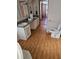 Clean bathroom with double vanity and updated flooring at 6274 Boatwrite Rd, Spring Hill, FL 34609