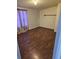 Bright bedroom featuring wood-look floors and window coverings at 6274 Boatwrite Rd, Spring Hill, FL 34609