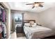 Bedroom with large window and ceiling fan at 6543 Spanish Moss Cir, Tampa, FL 33625