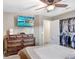 Bedroom with dresser, large TV and walk-in closet at 6543 Spanish Moss Cir, Tampa, FL 33625