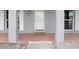 Hexagonal tile porch floor with a welcome mat and white door at 6543 Spanish Moss Cir, Tampa, FL 33625