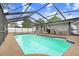 Screened pool and patio area with outdoor kitchen at 6543 Spanish Moss Cir, Tampa, FL 33625