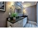 Modern bathroom with dark granite countertop at 7600 Sun Island S Dr # 804, South Pasadena, FL 33707