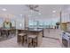 Modern kitchen with granite island and wine cooler at 7600 Sun Island S Dr # 804, South Pasadena, FL 33707