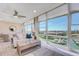 Living area boasts water views, comfy couch, and large windows at 7600 Sun Island S Dr # 804, South Pasadena, FL 33707