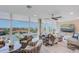 Open living space with water views and large screen TV at 7600 Sun Island S Dr # 804, South Pasadena, FL 33707