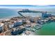 Aerial view showing building, bridge, and waterfront at 800 S Gulfview Blvd # 101, Clearwater Beach, FL 33767