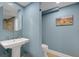 Small bathroom with pedestal sink, toilet and shower at 800 S Gulfview Blvd # 101, Clearwater Beach, FL 33767