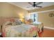 Bedroom with two twin beds, ceiling fan and balcony access at 800 S Gulfview Blvd # 101, Clearwater Beach, FL 33767