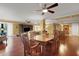 Dining area with hardwood floors and wooden dining table at 800 S Gulfview Blvd # 101, Clearwater Beach, FL 33767