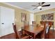 Bright dining room with hardwood floors and a wooden table at 800 S Gulfview Blvd # 101, Clearwater Beach, FL 33767