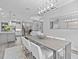 Bright dining room featuring a spacious table and modern chandelier at 821 Forest Glen Ct, Palm Harbor, FL 34683