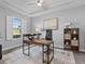 Modern home office with wood desk and window at 821 Forest Glen Ct, Palm Harbor, FL 34683