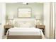 Bedroom with light walls, queen bed, and soft color palette at 8412 Sea Ray Run, Parrish, FL 34219