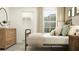 Bedroom with wood dresser and metal bed frame at 8412 Sea Ray Run, Parrish, FL 34219