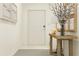 Light and airy entryway with a console table and wall decor at 8412 Sea Ray Run, Parrish, FL 34219