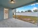 Covered patio overlooking a fenced-in backyard at 9100 52Nd N Way, Pinellas Park, FL 33782