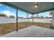 Covered patio overlooking a fenced-in backyard at 9100 52Nd N Way, Pinellas Park, FL 33782