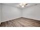 Spacious bedroom featuring wood-look floors and ceiling fan at 9100 52Nd N Way, Pinellas Park, FL 33782