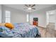 Main bedroom with large windows and ceiling fan at 9100 52Nd N Way, Pinellas Park, FL 33782