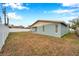 Rear view of the house showing a light blue exterior at 9100 52Nd N Way, Pinellas Park, FL 33782