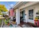 Inviting front porch with decorative plants and seating at 9231 41St N St # 5, Pinellas Park, FL 33782