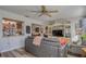 Living room with gray couch, built in shelving and kitchen peek at 9231 41St N St # 5, Pinellas Park, FL 33782