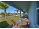 Covered patio with seating area, overlooking a fenced backyard at 935 Signet Dr, Apollo Beach, FL 33572