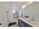 Elegant bathroom with double vanity and large mirror at 935 Signet Dr, Apollo Beach, FL 33572