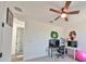 Multipurpose bedroom with a desk and gaming setup at 935 Signet Dr, Apollo Beach, FL 33572