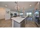 Modern kitchen with stainless steel appliances and large island at 935 Signet Dr, Apollo Beach, FL 33572