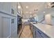 Modern kitchen with gray cabinets and stainless steel appliances at 935 Signet Dr, Apollo Beach, FL 33572