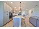 Gray cabinets, herringbone floors, and a large kitchen island at 935 Signet Dr, Apollo Beach, FL 33572