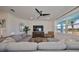 Spacious living room with sectional sofa and large TV at 935 Signet Dr, Apollo Beach, FL 33572