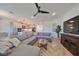 Bright living room with sectional sofa and hardwood floors at 935 Signet Dr, Apollo Beach, FL 33572