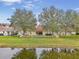 House with fenced backyard and water view at 9551 Jaybird Ln, Land O Lakes, FL 34638