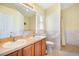 Bathroom features double sinks and a shower/tub combo at 9551 Jaybird Ln, Land O Lakes, FL 34638