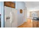 White appliances and wood cabinets in this eat-in kitchen at 9551 Jaybird Ln, Land O Lakes, FL 34638