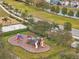 Community playground with play structures at 9551 Jaybird Ln, Land O Lakes, FL 34638