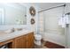 Clean bathroom with tub and updated vanity at 9607 Maxson Dr, Land O Lakes, FL 34638