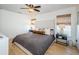 Spacious bedroom with king-size bed and ceiling fan at 9607 Maxson Dr, Land O Lakes, FL 34638