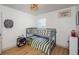 Bright bedroom with a bunk bed and a dartboard at 9607 Maxson Dr, Land O Lakes, FL 34638