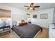 Spacious bedroom with king-size bed and ceiling fan at 9607 Maxson Dr, Land O Lakes, FL 34638