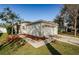 One-story home with a two-car garage and neatly landscaped front yard at 9607 Maxson Dr, Land O Lakes, FL 34638