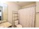 Clean bathroom with shower/tub combo, granite vanity, and storage at 4762 White Sanderling Ct, Tampa, FL 33619