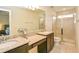 Double vanity bathroom with granite countertops and a walk-in shower at 4762 White Sanderling Ct, Tampa, FL 33619