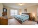 Spacious main bedroom with a king-size bed and ample closet space at 4762 White Sanderling Ct, Tampa, FL 33619